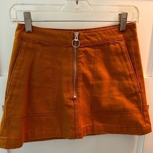 Pumpkin colored mini skirt by weekday. Size 34 euro. Excellent condition.